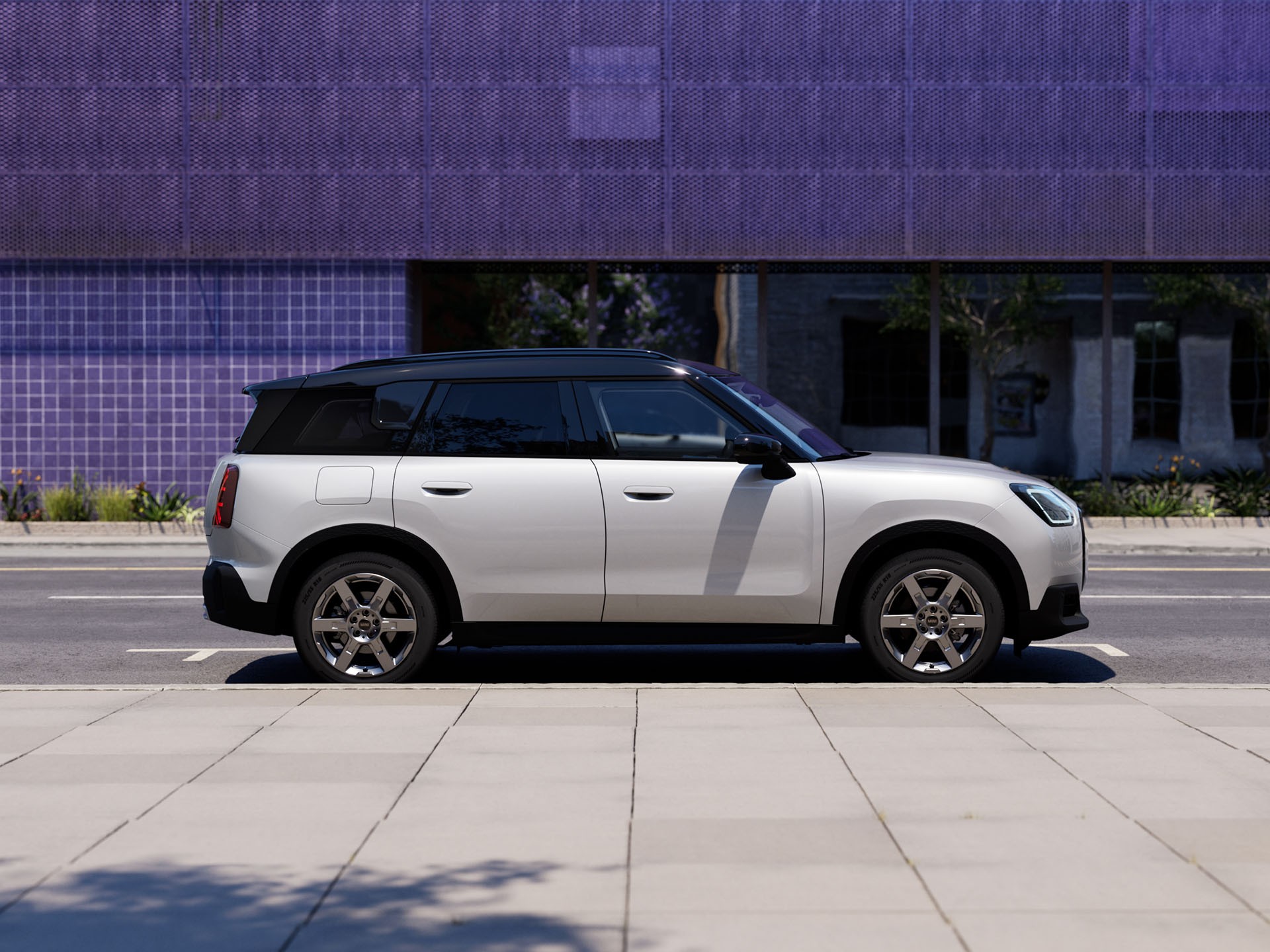 MINI Countryman parked off-road near hills